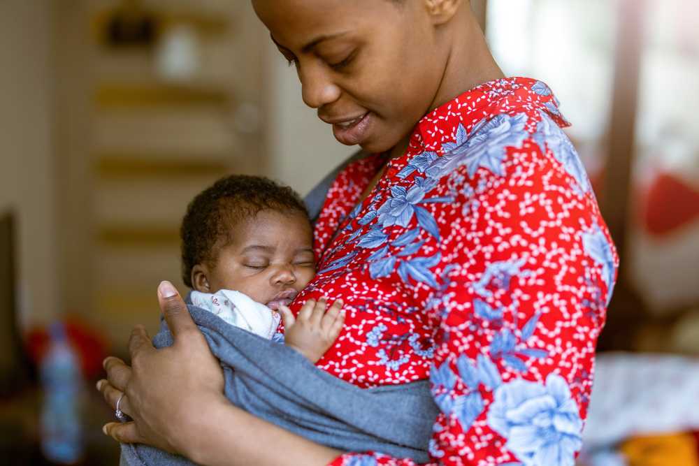 Thumbnail showing a mother holding her infant child